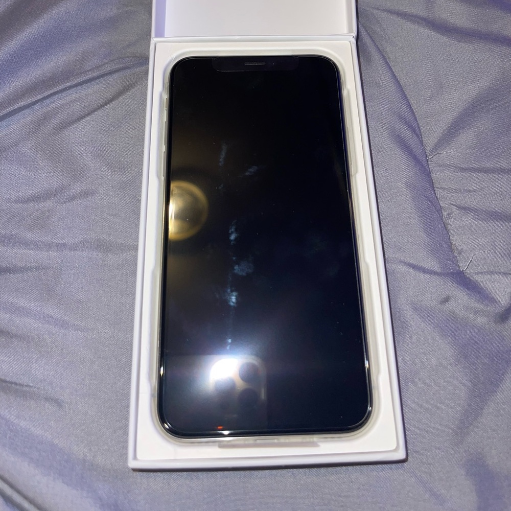 iPhone X  64GB Brand New! Never used still in the box. Silver edges white back.